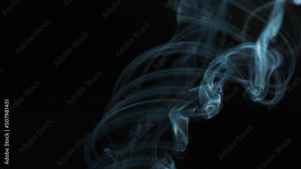 Abstract smoke rises up in beautiful swirls on a black background. Abstract smoke rises up in beautiful swirls on a black background.