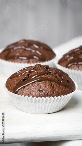 Little chocolate muffins in white background