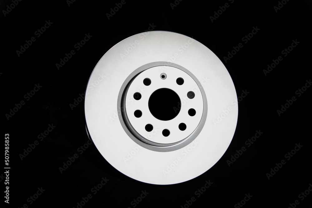Car brake discs on a black background, isolate. Disc brake system, effective braking, close-up Car brake discs on a black background, isolate. Disc brake system, effective braking, close-up