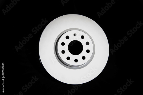 Car brake discs on a black background, isolate. Disc brake system, effective braking, close-up