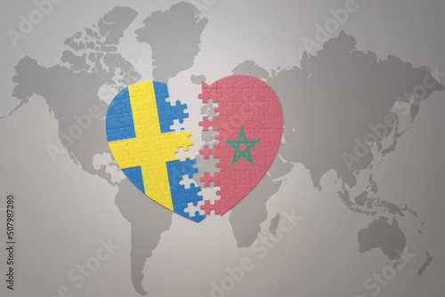puzzle heart with the national flag of sweden and morocco on a world map background. Concept.