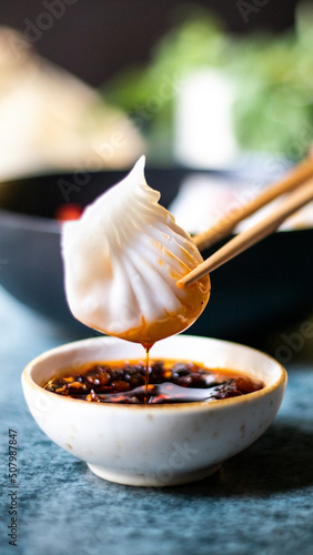 Dumplings with chopsticks and chilli oil