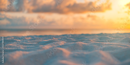 Closeup sea sand beach. Panoramic beach landscape. Blurred tropical beach seascape horizon. Orange and golden sunset sky calmness tranquil relaxing sunlight summer mood. Vacation travel holiday banner