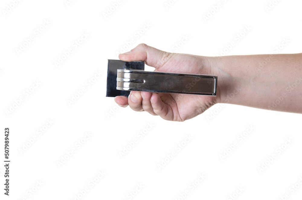 Door handle in hand on a white background, isolate. Close-up Door handle in hand on a white background, isolate. Close-up