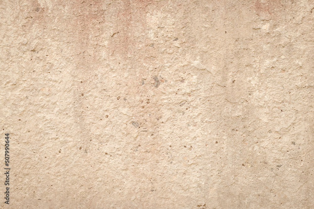 Beige cement wall, abstract light background. Concrete grunge texture, stucco. Plaster surface. Blank space. Design backdrop. Natural grungy wallpaper.