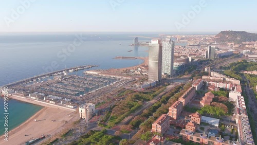 Barcelona, Spain: Aerial view of capital city of Catalonia, coast with beaches, sunny day with clear sky - landscape panorama of Europe from above photo