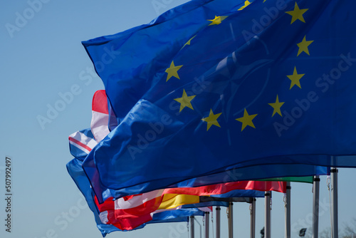 the flags. flags fluttering in the wind with a blue background. photo during the day.