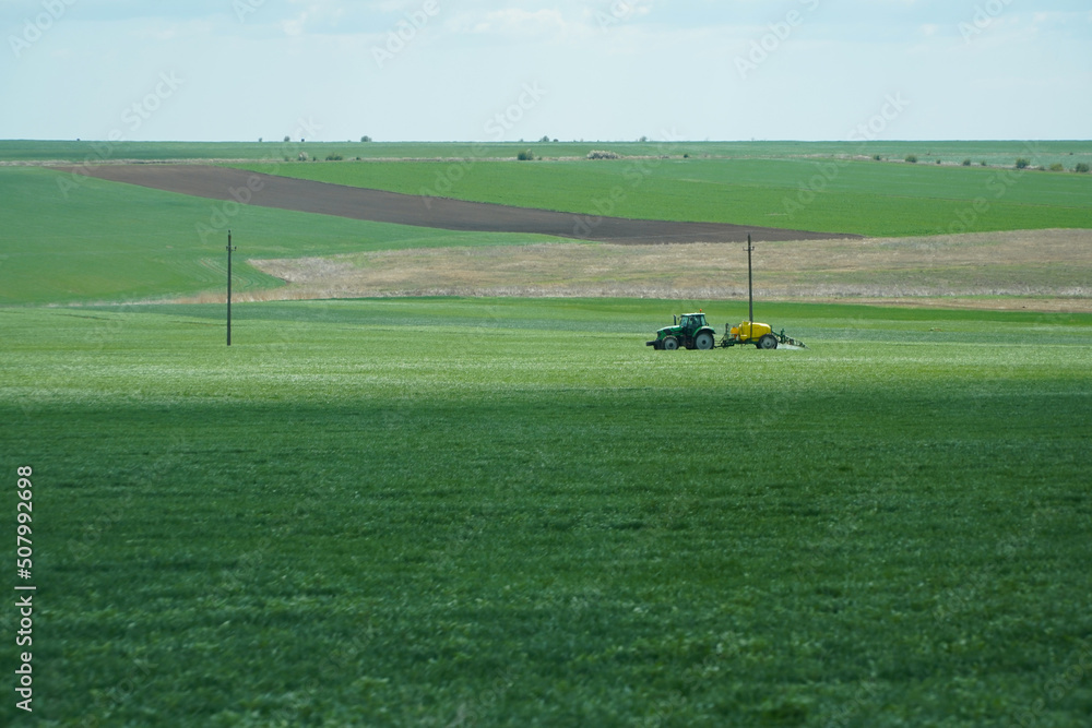 herbicide. equipment that weeds the crop against pests. photo during the day. agriculture.