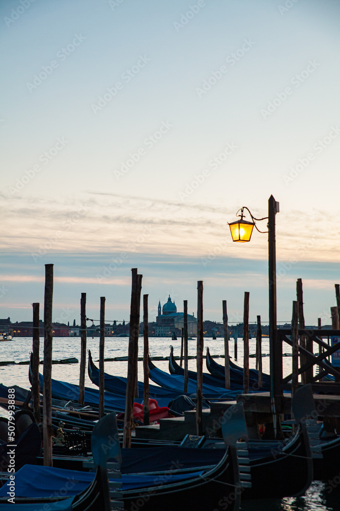 Venice gondolas at the pier in Canale de lla Giudecca