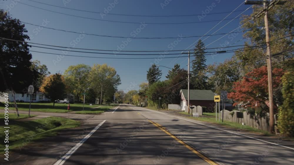 Driving in a typical American suburb, view from the driver's side