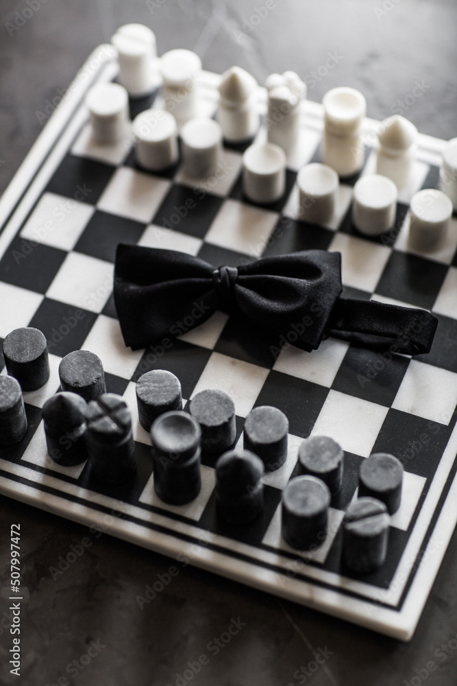 Wedding tie of the groom on a chessboard