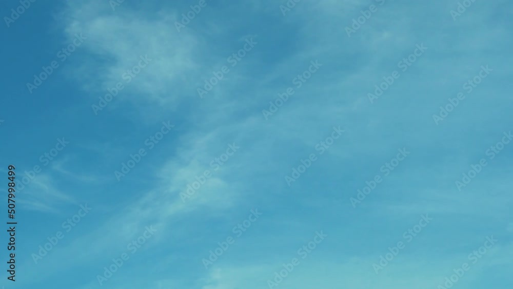 Azure Blue Clear Sky with Light Clouds in Sunny Weather, Time Lapse, Slow Motion. Atmosphere Blue Summer Sky, Cirrus Clouds. Beautiful Natural Background. Azone Layer, Height, Clear Skyscraper. Azure Blue Clear Sky with Light Clouds in Sunny Weather, Time Lapse, Slow Motion. Atmosphere Blue Summer Sky, Cirrus Clouds. Beautiful Natural Background. Azone Layer, Height, Clear Skyscraper.