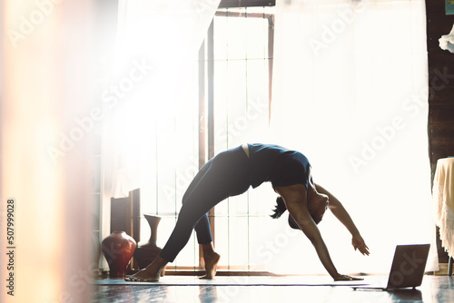Portrait of gorgeous young woman practicing yoga outdoor. Beautiful girl practice cobra asana in class.Calmness and relax, female happiness.Horizontal, blurred background