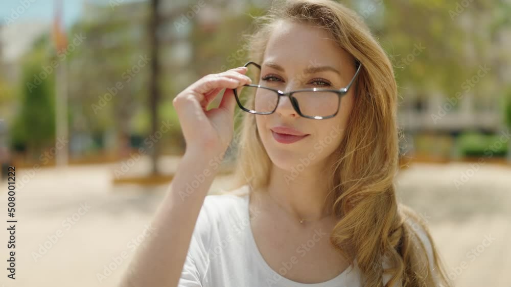 Young blonde woman smiling confident wearing glasses at park Young blonde woman smiling confident wearing glasses at park