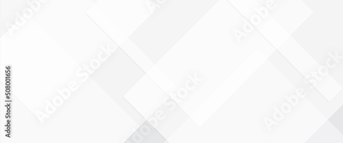 Abstract white background with diamond and triangle shapes layered in modern abstract pattern white background. geometric lines angles shapes in white and gray layers of transparent material.
