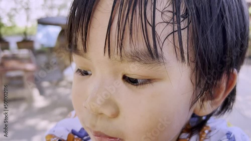 Close-up portrait of worry and scare face of kid