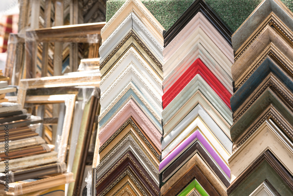 Various wooden and plastic picture frames in different colours and ...