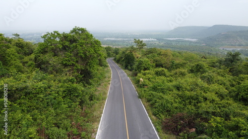  top view of road aerial view tropical mountains landscape.