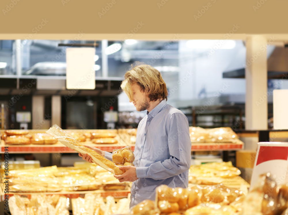 Man choosing bread from a supermarket.