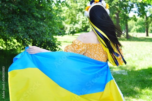 Woman with Ukrainian yellow and blue national flag of Ukraine 