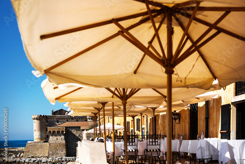 Canvas Print View of the Italian castle through the restaurant