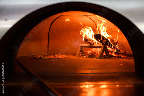 Pizza is cooked in the oven © tsezarina