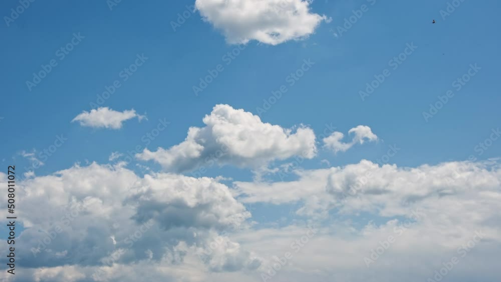 Beautiful lush white clouds float across the blue sky Time Lapse. Cloud background. Nature, cloudscape, fluffy white clouds interval shooting. Sunny sky with clouds Beautiful lush white clouds float across the blue sky Time Lapse. Cloud background. Nature, cloudscape, fluffy white clouds interval shooting. Sunny sky with clouds