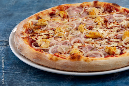 tasty italian pizza on wooden background