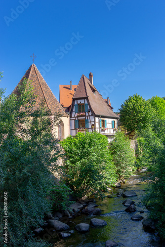 historic half-timbered houses on the Weiss River in the village center of Kaysersberg