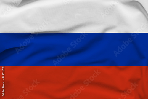 Russian Federation national flag, folds and hard shadows on the canvas