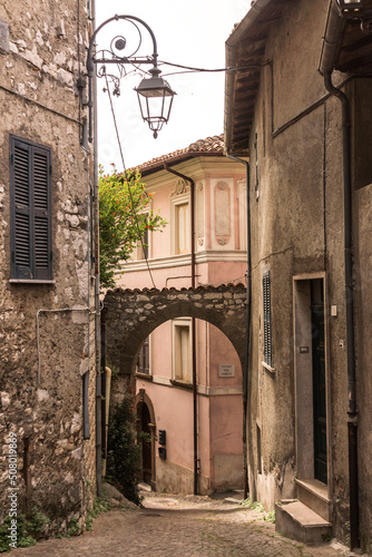 street in old town of Ceccano with castle photo