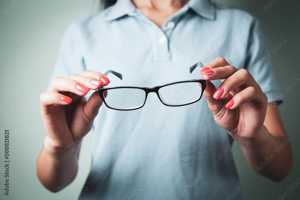 girl holding glasses in her hand girl holding glasses in her hand