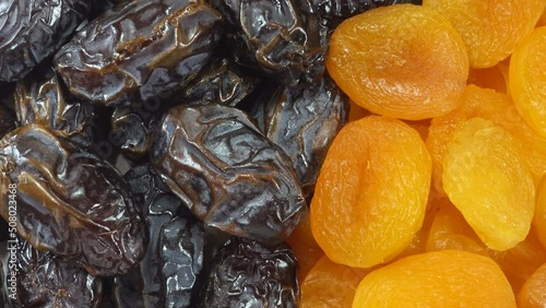 4K view of heaps of dried fruit dates and apricots.