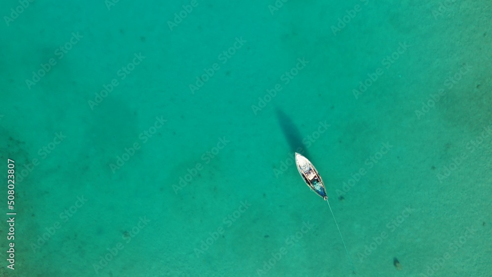Aerial view of a fisherman boat on amazing bay.