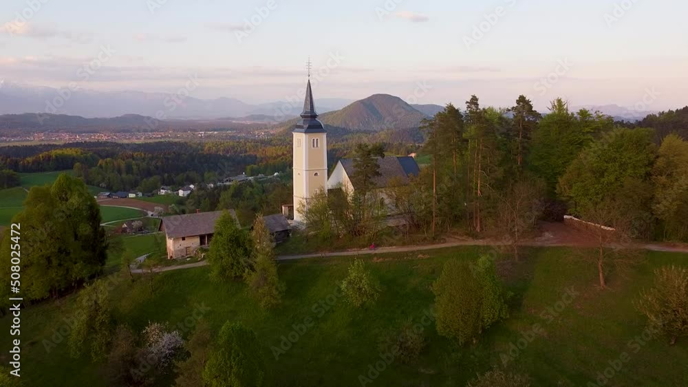 view of the village with a church on a beautiful sunset view of the village with a church on a beautiful sunset