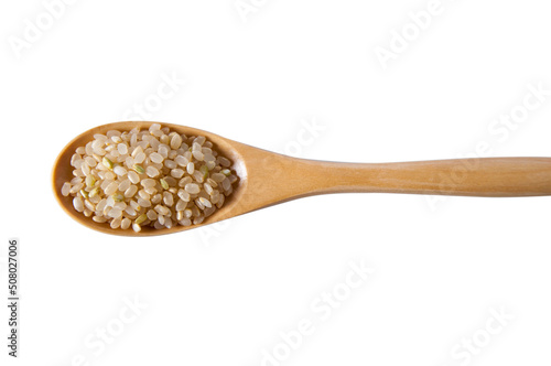 Wooden spoon, filled, fresh, white rice, white background