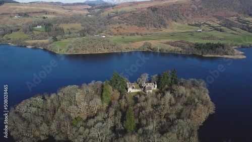 Inchmahome Priory on Inchmahome island in Menteith lake, Scotland. Aerial forward tilt down photo