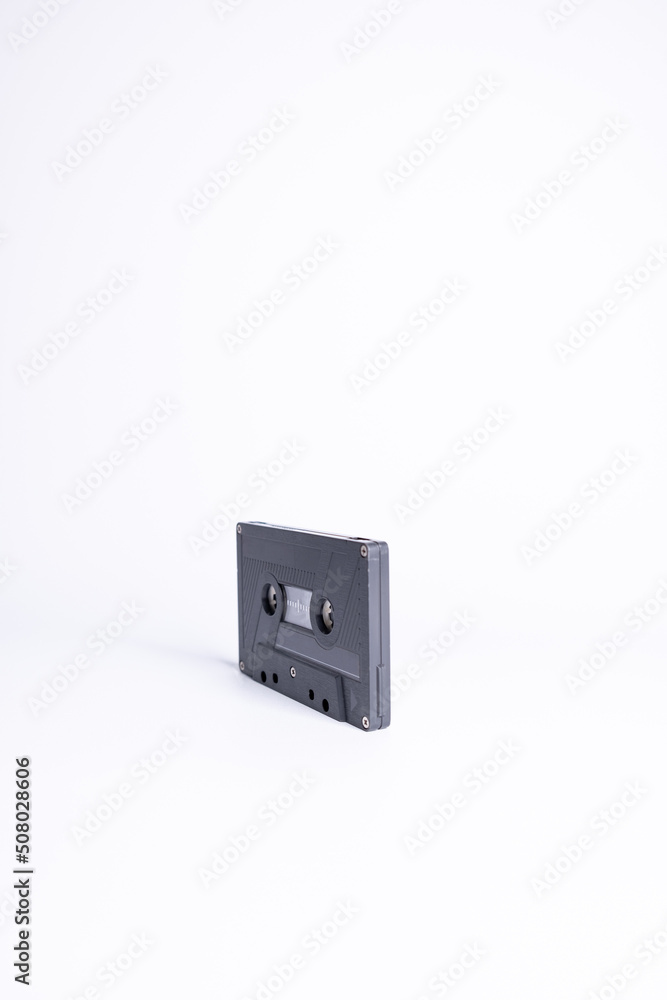 Audio cassette close up, isolated on white background. Analog Audio Tape. Audio K7 Tape isolated and center on white background. Audio cassette close up, isolated on white background. Analog Audio Tape. Audio K7 Tape isolated and center on white background.