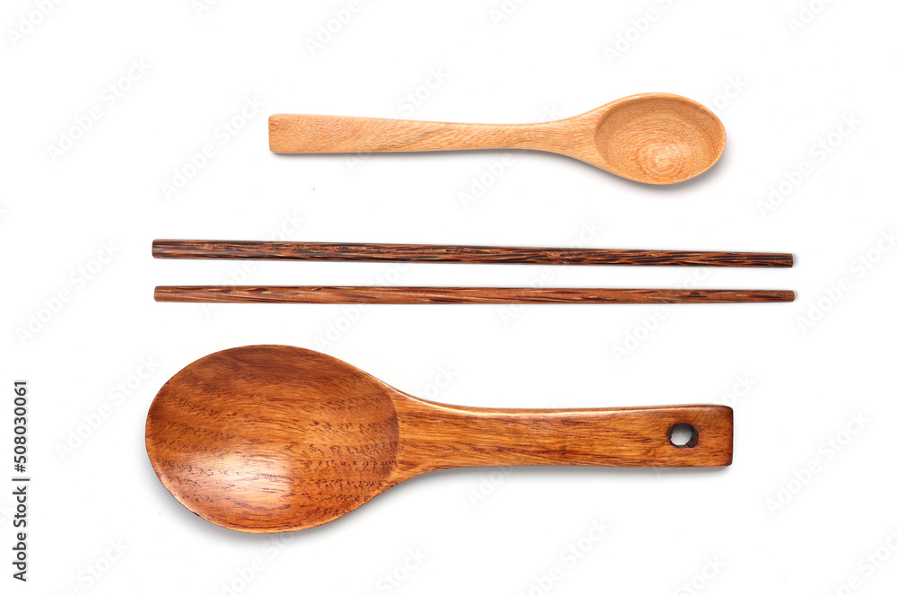 Set of wooden spoons and chopsticks isolated on white background. Set of wooden spoons and chopsticks isolated on white background.