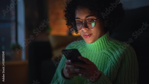 Wallpaper Mural Multiethnic Woman Using Smartphone while Resting at Home. Black Female Blogger Creating Content and Chatting to Subscribers Over the Internet. Using Social Networks Concept. Slow Motion Torontodigital.ca