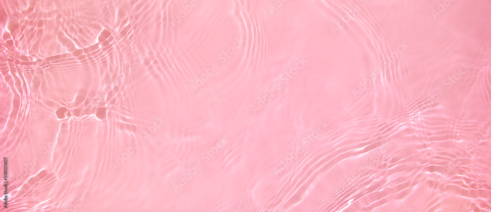 Abstract summer banner background Transparent pink clear water surface texture with ripples, splashes. Water wave in sunlight, copy space, top view. Cosmetics moisturizer micellar toner emulsion Abstract summer banner background Transparent pink clear water surface texture with ripples, splashes. Water wave in sunlight, copy space, top view. Cosmetics moisturizer micellar toner emulsion