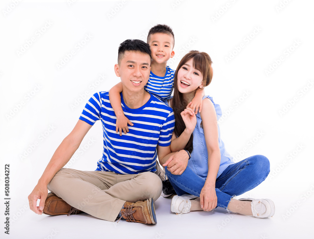 Happy family looking at camera and sitting on white background Happy family looking at camera and sitting on white background