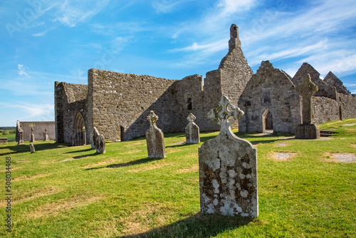 Clonmacnoise Cathedral  with the typical crosses and graves photo