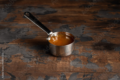 Cheese sauce, mustard, sour cream, tomato, sweet and sour sauce on a wooden background