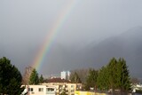 Rainbow in the city over eht hills and houses. Slovakia