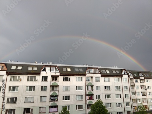 Rainbow in the city over eht hills and houses. Slovakia