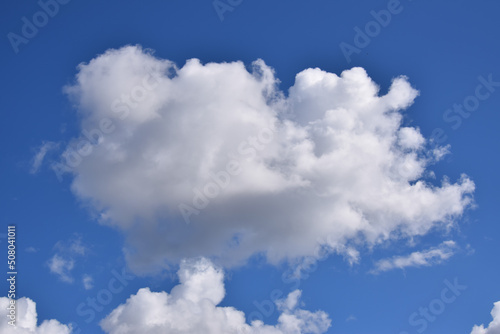 A cloud on a bluish sky  beautiful summer weather. Background and picture for weather forecast.