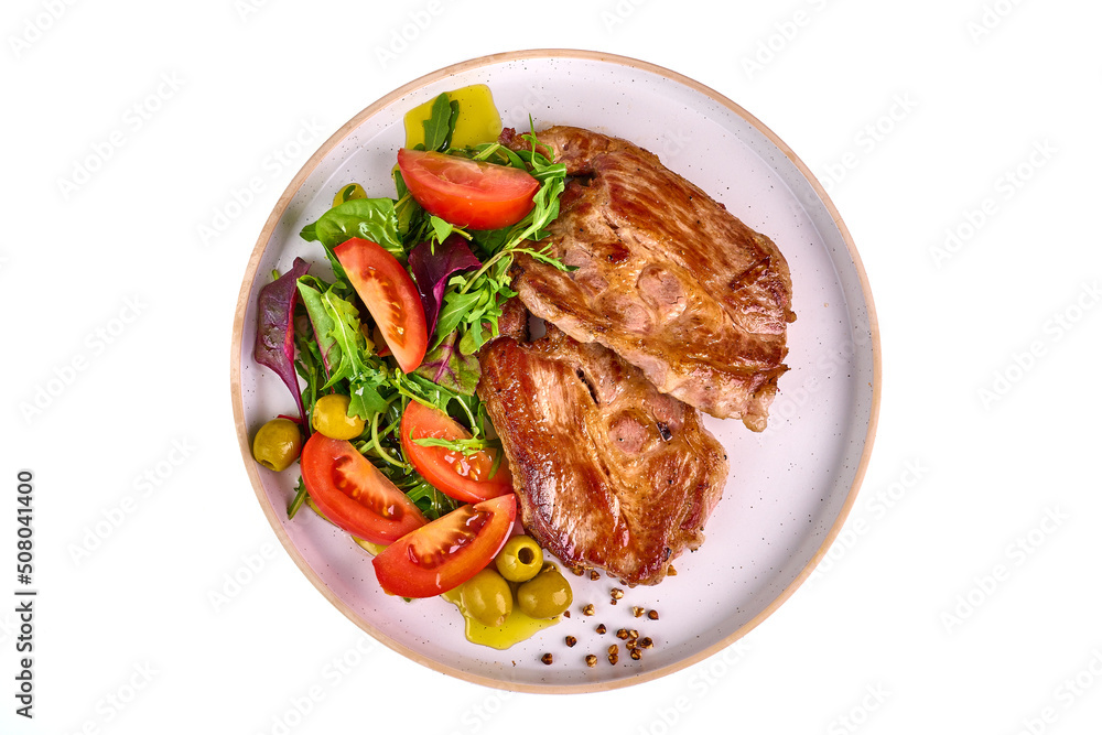 Grilled pork shoulder steak with vegetable salad, isolated on white background. Grilled pork shoulder steak with vegetable salad, isolated on white background.