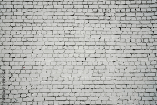 Large and long empty white aged brick wall front view outdoor of urban street. Brickwork background.