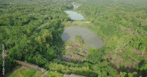 Aerial flyover big lakes in wilderness of Indonesia during sunny day, BEBENG RIVER in Slope of Merapi Volcano photo